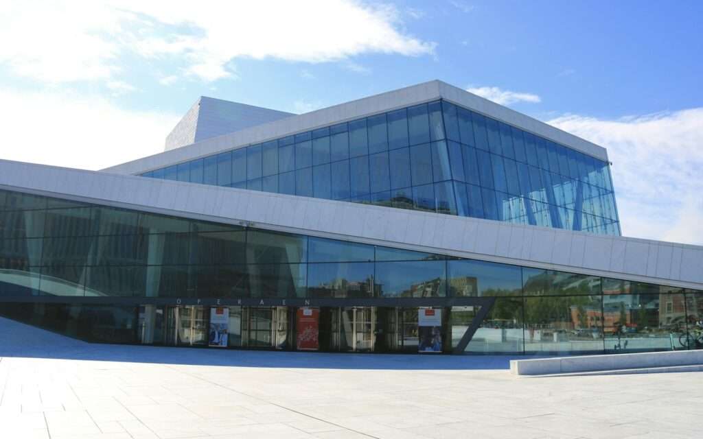 The white marble slopes and glass facade of the Oslo Opera House