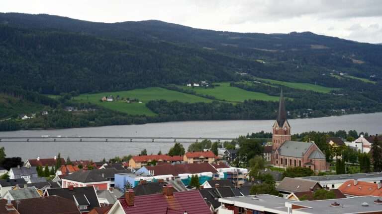 Lillehammer's church and rooftops above Lake Mjøsa and its long bridge