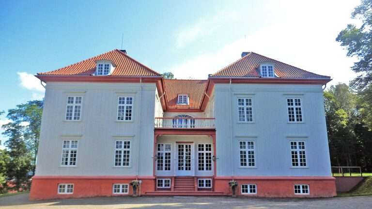 The white timber facade of the Eidsvoll Manor, Norway's constitution house